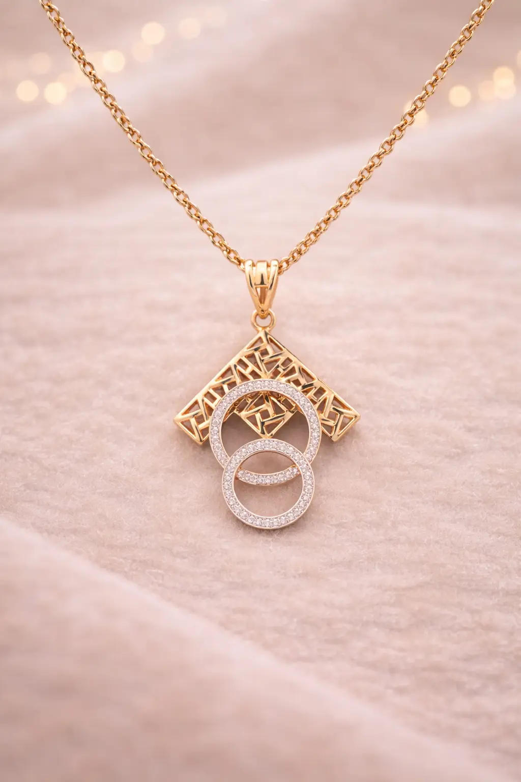 Minimal gold pendant on satin